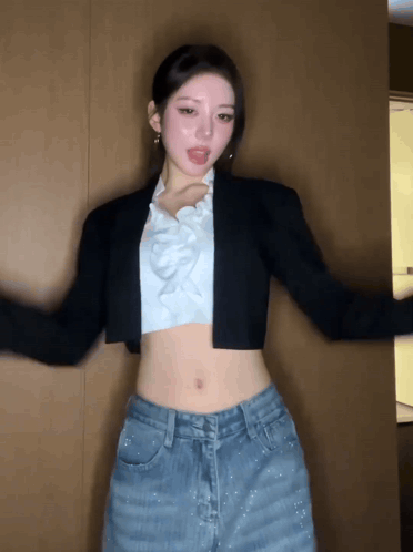 Woman in Crop Top and Jeans Dancing