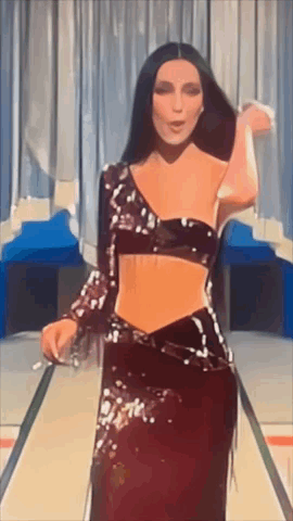 Woman in Crop Top and Long Skirt Dancing on Stage