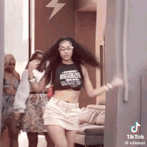 Woman In Crop Top And White Shorts Dancing With Others GIF