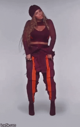 Woman In Crop Top Dancing With Crossed Legs GIF