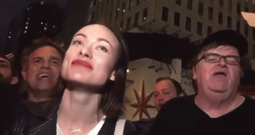 Woman in Crowd Looking Up