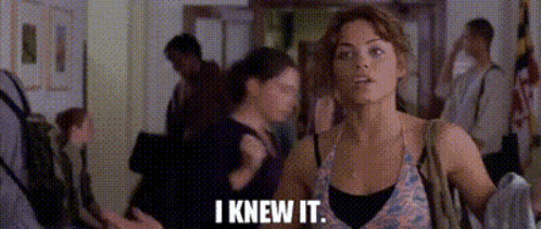 Woman in Crowded Hallway Saying I Knew It