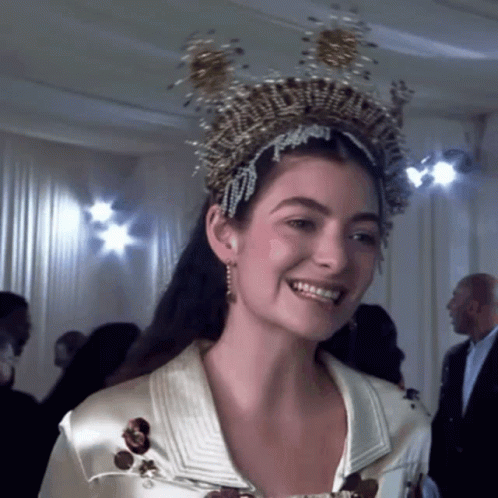 Woman In Crown Smiling At Camera GIF