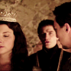 Woman in Crown Standing Next to Man