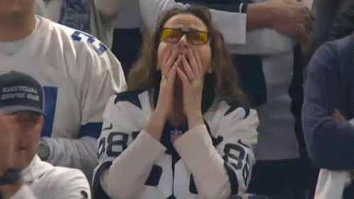 Woman in Dallas Cowboys Jersey Covering Face