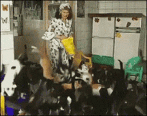 Woman in Dalmatian Costume Feeding Cats