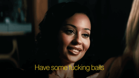 Woman in Dark Room Saying Have Some Fucking Balls