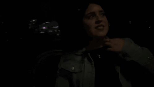 Woman in Dark Room Saying Its Funny