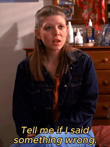 Woman in Denim Jacket Says Tell Me Wrong