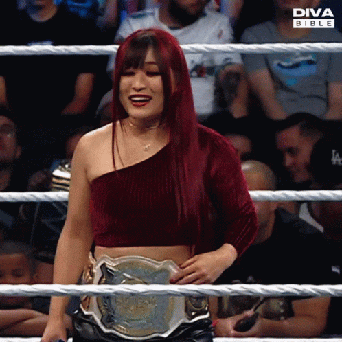 Woman in Diva Bible Ring Holding Wrestling Belt