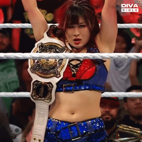 Woman in Diva Bible Wrestling Ring Holding Arms Up