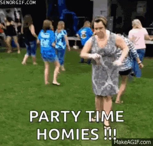 Woman in Dress Dancing in Grass With Crowd