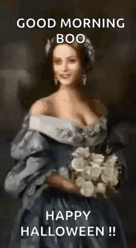 Woman In Dress Holding Flowers Says Good Morning Boo Happy Halloween GIF