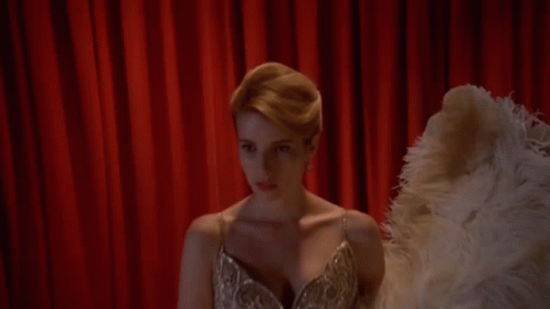 Woman in Dress Holding Ostrich Feather Fan