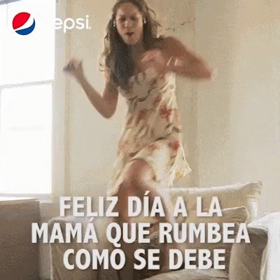 Woman In Dress Jumping And Dancing On Couch GIF