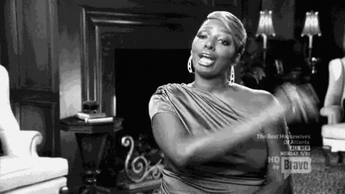 Woman In Dress Sitting In Living Room GIF