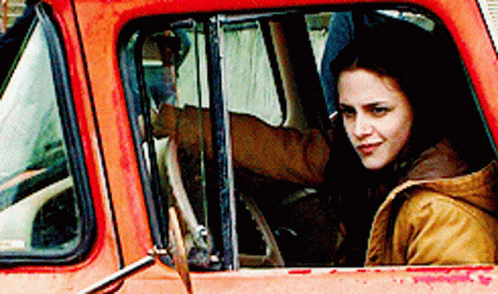 Woman in Driver's Seat of Orange Truck
