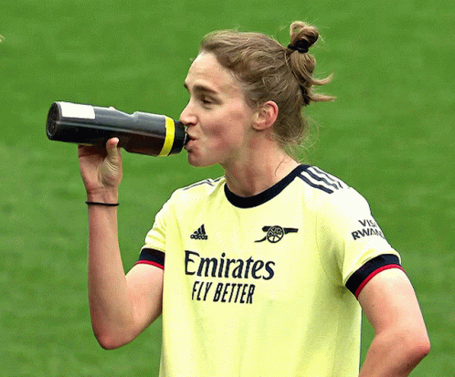 Woman In Emirates Jersey Drinking Water GIF