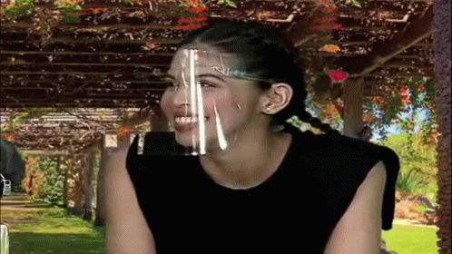Woman In Face Shield Smiling GIF
