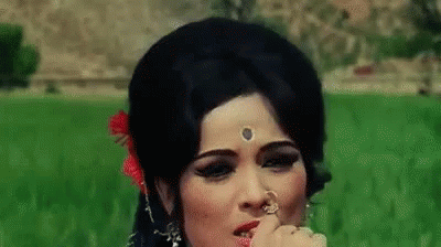 Woman in Field with Flower in Hair and Nose Ring