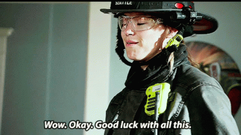 Woman in Fireman Uniform Wow Okay Good Luck
