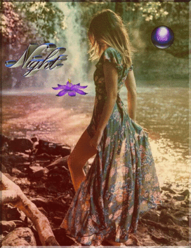 Woman in Floral Dress at Waterfall Night