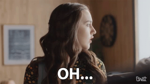 Woman in Floral Dress Saying Oh