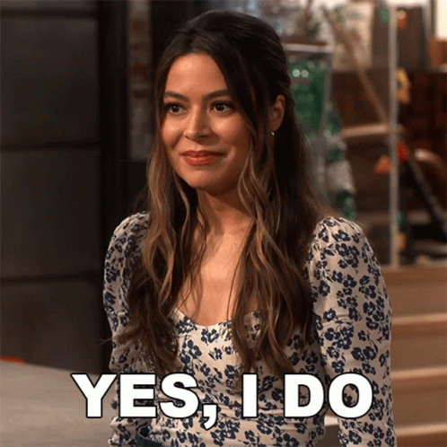 Woman In Floral Dress Saying Yes GIF