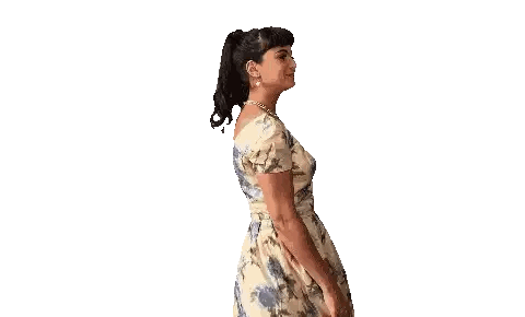 Woman in Floral Dress Spreading Arms