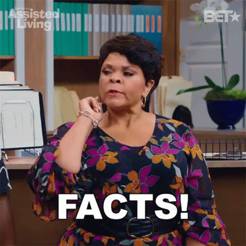 Woman In Floral Dress Talking On Phone GIF