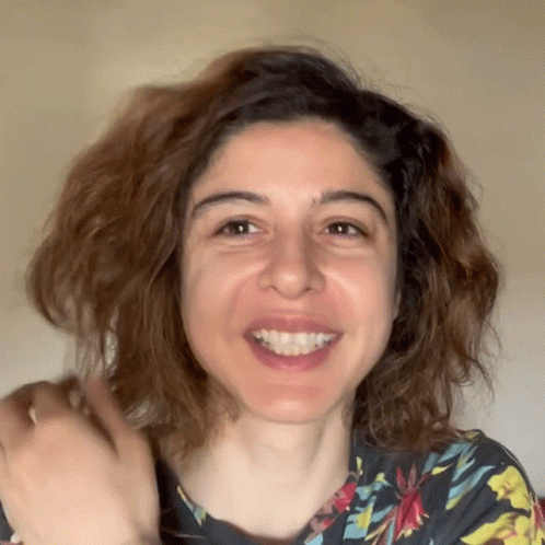 Woman in Floral Shirt Smiling