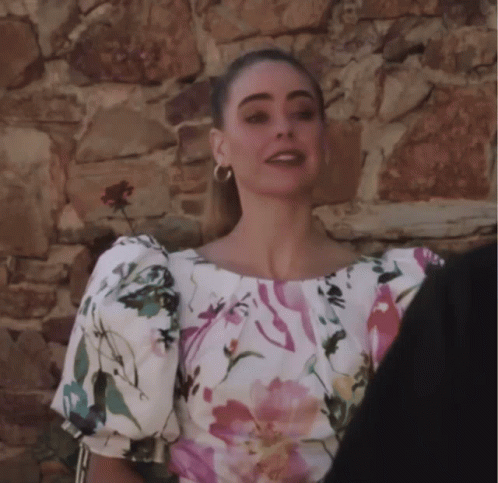 Woman in Floral Top With Puffed Sleeves