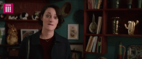 Woman in Front of Bookshelf With BBC