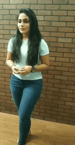 Woman in Front of Brick Wall