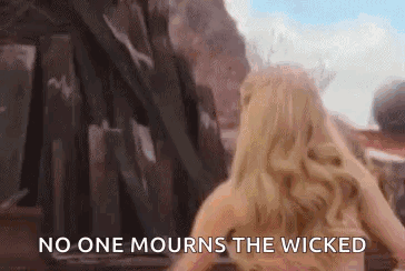Woman In Front Of Building Saying No One Mourns The Wicked GIF