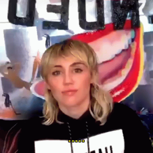 Woman in Front of Deluxe Sign