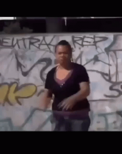 Woman In Front Of Graffiti Wall Saying Rep GIF