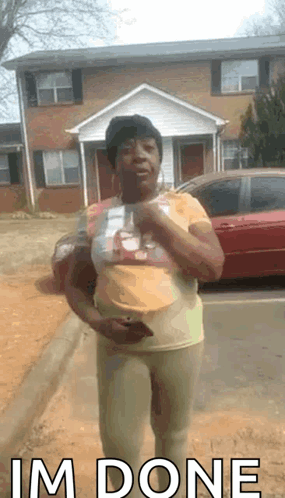 Woman in Front of House Saying I'm Done