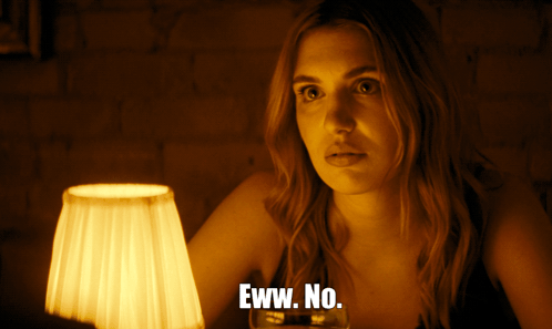 Woman In Front Of Lamp Saying Eww No GIF