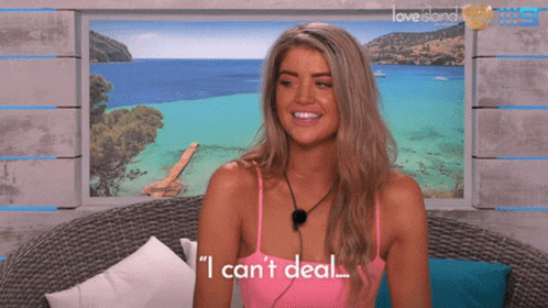 Woman In Front Of Love Island Poster GIF