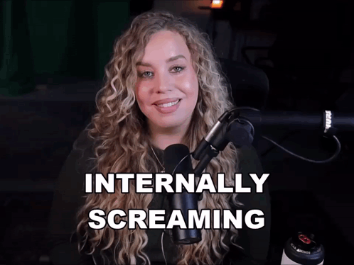 Woman in Front of Microphone Internally Screaming