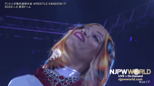 Woman In Front Of NJpwworld Live and On-Demand Sign