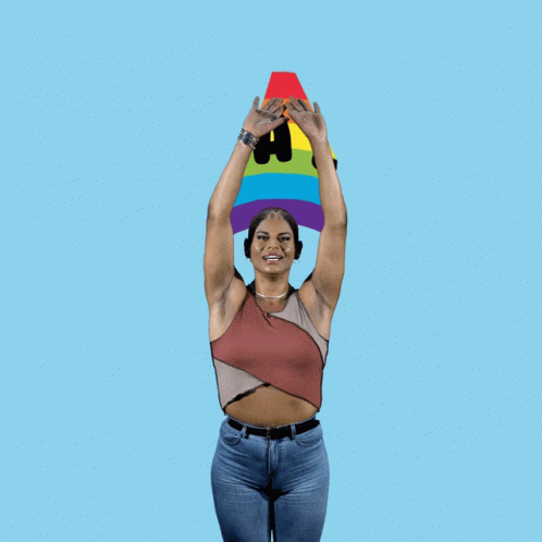 Woman In Front Of Rainbow Saying Equality GIF