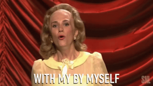 Woman in Front of Red Curtain Saying With My By Myself