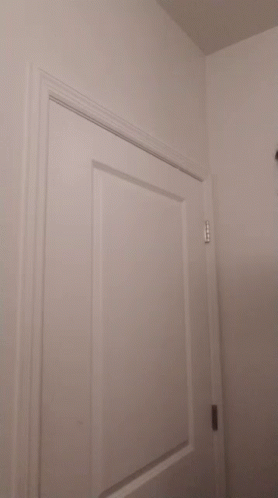 Woman in Front of White Door