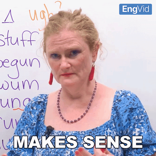 Woman in Front of Whiteboard Saying Makes Sense