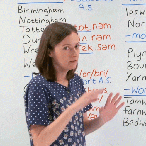 Woman in Front of Whiteboard Saying Slightly Different
