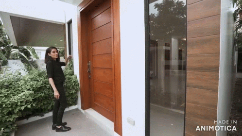 Woman in Front of Wooden Door