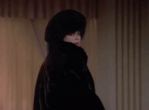 Woman in Fur Coat and Hat Smiling