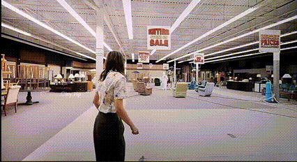 Woman in Furniture Store With Metro Section Sale Sign
